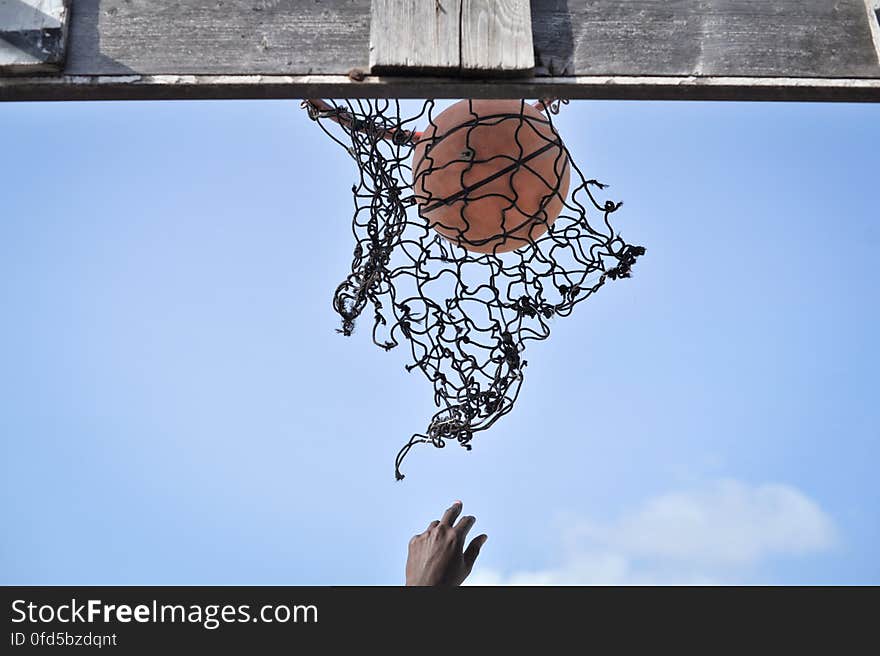 A ball is shot through an old basketball net on a court in Mogadishu, Somalia, on June 6. Banned under the extremist group, Al Shabaab, Basketball is once again making a resurgence in Mogadishu. Today at least a dozen teams in the city play in a league and both men and women are coming out to play the sport. AU UN IST PHOTO / TOBIN JONES. A ball is shot through an old basketball net on a court in Mogadishu, Somalia, on June 6. Banned under the extremist group, Al Shabaab, Basketball is once again making a resurgence in Mogadishu. Today at least a dozen teams in the city play in a league and both men and women are coming out to play the sport. AU UN IST PHOTO / TOBIN JONES