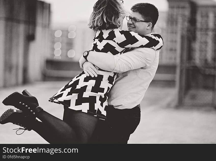 Rear View of Couple Walking in City