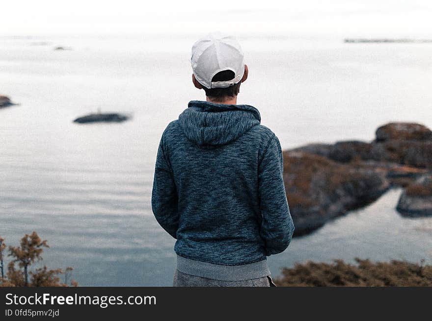 Rear View of a Man Standing on Beach