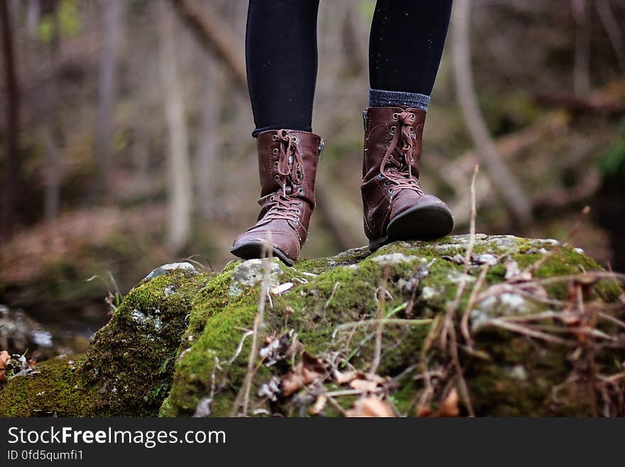 Low Section of Man Standing in Forest