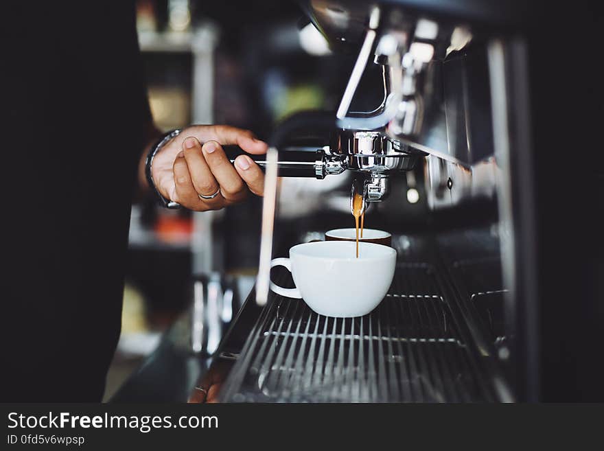 Close-up of Hand Holding Coffee Machine