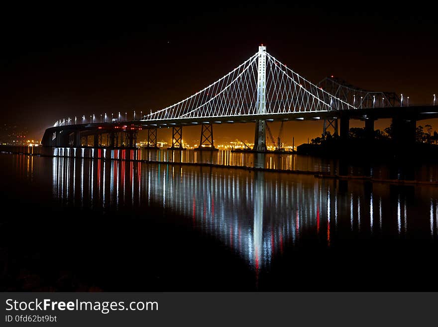 Illuminated Suspension Bridge Against Sky at Night