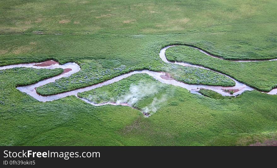 A hot spring discharges 77°C &#x28;~171°F&#x29; water into Hot Springs Creek, Akutan Island, Alaska, Akutan Volcano &#x28;photo&#x29;. Numerous industry-led geophysical studies and test drilling in the past few years have proven the existence of a geothermal resource. USGS field studies completed in 2012 suggest that the available geothermal resource may be even larger than previously recognized. The current heat output of the hot spring system is estimated at 29 megawatts – nearly ten times higher than measured in the early 1980s. This large increase may reflect the volcanic and seismic events of the 1990s, and if so, it cannot be considered a short-term anomaly. Modern geothermal plants could use this heat to generate several MW of electricity. One MW of electric power would supply the needs of about 750 homes. You can read more details and find the full report at www.usgs.gov/newsroom/article.asp?ID=3776 Photo credit: Deborah Bergfeld, USGS. A hot spring discharges 77°C &#x28;~171°F&#x29; water into Hot Springs Creek, Akutan Island, Alaska, Akutan Volcano &#x28;photo&#x29;. Numerous industry-led geophysical studies and test drilling in the past few years have proven the existence of a geothermal resource. USGS field studies completed in 2012 suggest that the available geothermal resource may be even larger than previously recognized. The current heat output of the hot spring system is estimated at 29 megawatts – nearly ten times higher than measured in the early 1980s. This large increase may reflect the volcanic and seismic events of the 1990s, and if so, it cannot be considered a short-term anomaly. Modern geothermal plants could use this heat to generate several MW of electricity. One MW of electric power would supply the needs of about 750 homes. You can read more details and find the full report at www.usgs.gov/newsroom/article.asp?ID=3776 Photo credit: Deborah Bergfeld, USGS.