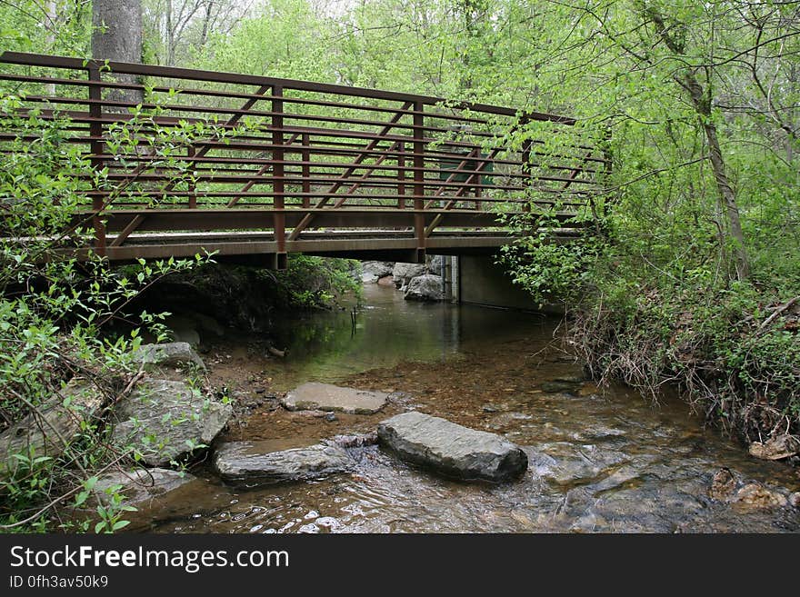 A view from Soper Branch creek with a USGS streamgage on the other side of the bridge. Soper Branch is a small stream near Hyattstown, MD, that is part of the Chesapeake Bay watershed. For more than 125 years, starting with the establishment of the first streamgage in Embudo, N.M., on Jan. 1, 1889, the USGS has monitored flow in selected streams and rivers across the United States. The information is routinely used for water supply and management, monitoring floods and droughts, bridge and road design, determination of flood risk and for many recreational activities. The USGS currently operates 4,461 stations with more than 30 years of record, and 8,024 gages comprise the U.S. streamgage network today. Photo credit: Dianna Hogan, USGS. A view from Soper Branch creek with a USGS streamgage on the other side of the bridge. Soper Branch is a small stream near Hyattstown, MD, that is part of the Chesapeake Bay watershed. For more than 125 years, starting with the establishment of the first streamgage in Embudo, N.M., on Jan. 1, 1889, the USGS has monitored flow in selected streams and rivers across the United States. The information is routinely used for water supply and management, monitoring floods and droughts, bridge and road design, determination of flood risk and for many recreational activities. The USGS currently operates 4,461 stations with more than 30 years of record, and 8,024 gages comprise the U.S. streamgage network today. Photo credit: Dianna Hogan, USGS