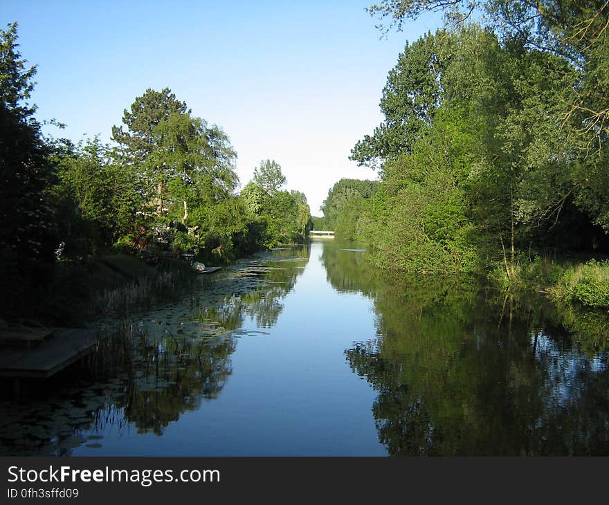 Stretch of water a few tens of meters north of and parallel to Kalfjeslaan &#x28;name of street&#x29;, in Buitenveldert, Amsterdam, the Netherlands. Photograph taken looking due east, just south of Reimersbeek. Stretch of water a few tens of meters north of and parallel to Kalfjeslaan &#x28;name of street&#x29;, in Buitenveldert, Amsterdam, the Netherlands. Photograph taken looking due east, just south of Reimersbeek.