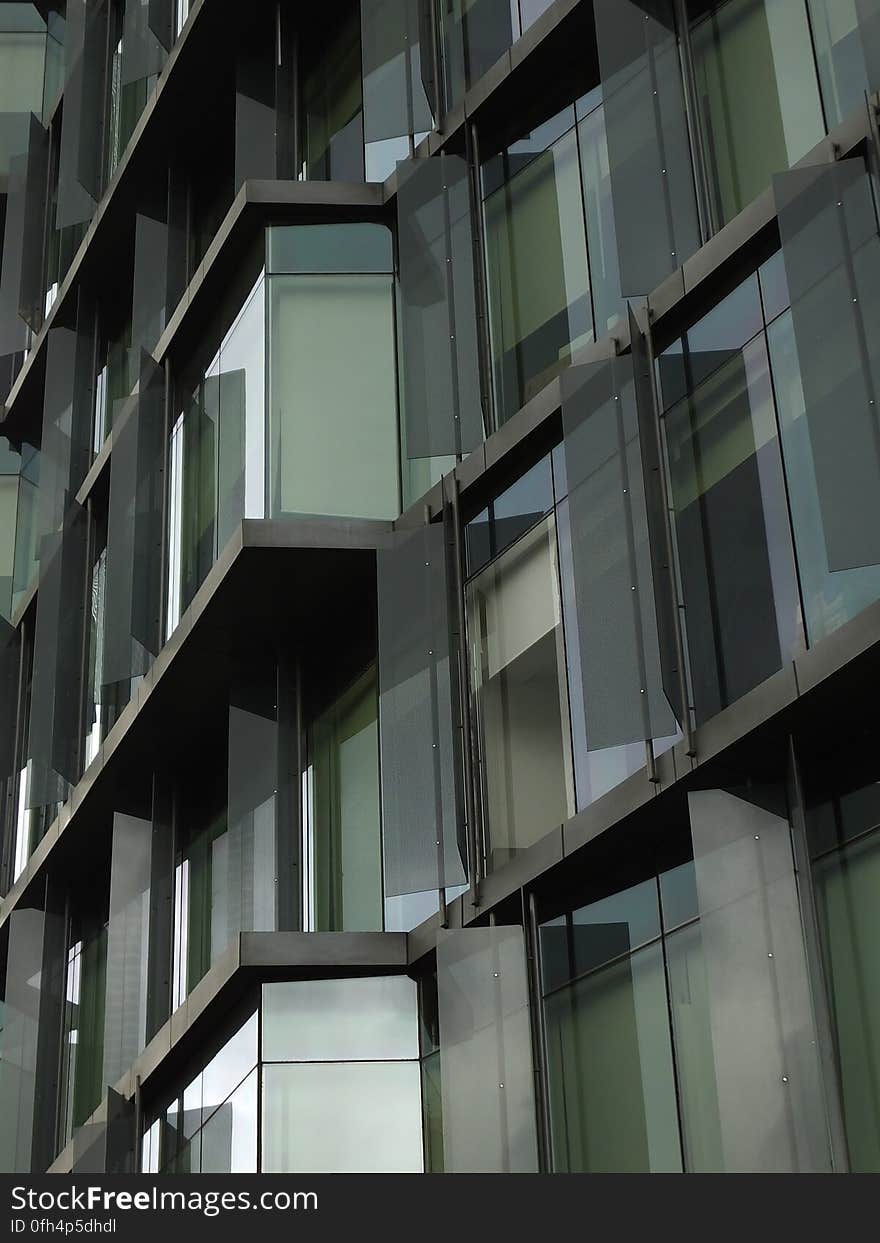 Windows on the facade of a modern office building. Windows on the facade of a modern office building.