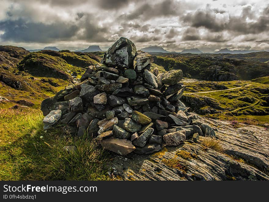 A hill landscape with a pile of rocks. A hill landscape with a pile of rocks.