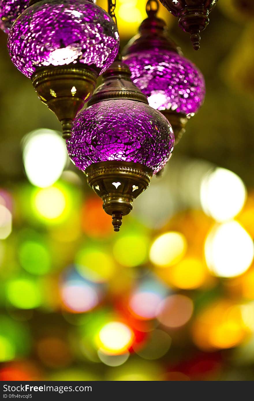 A close up of hanging decorative purple lanterns.