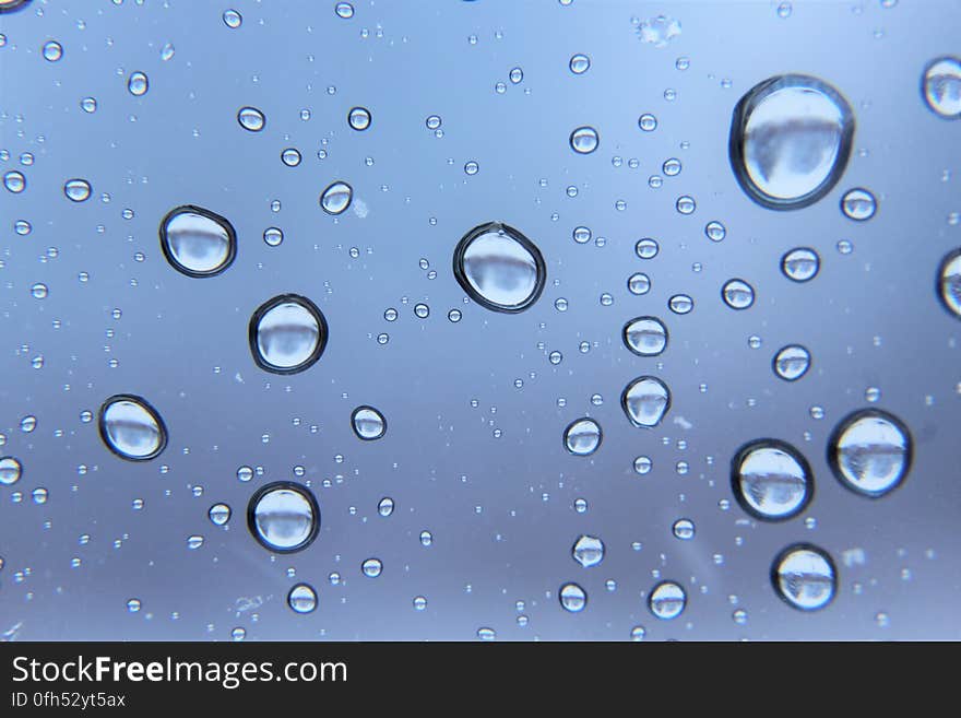 A window with clear water drops.