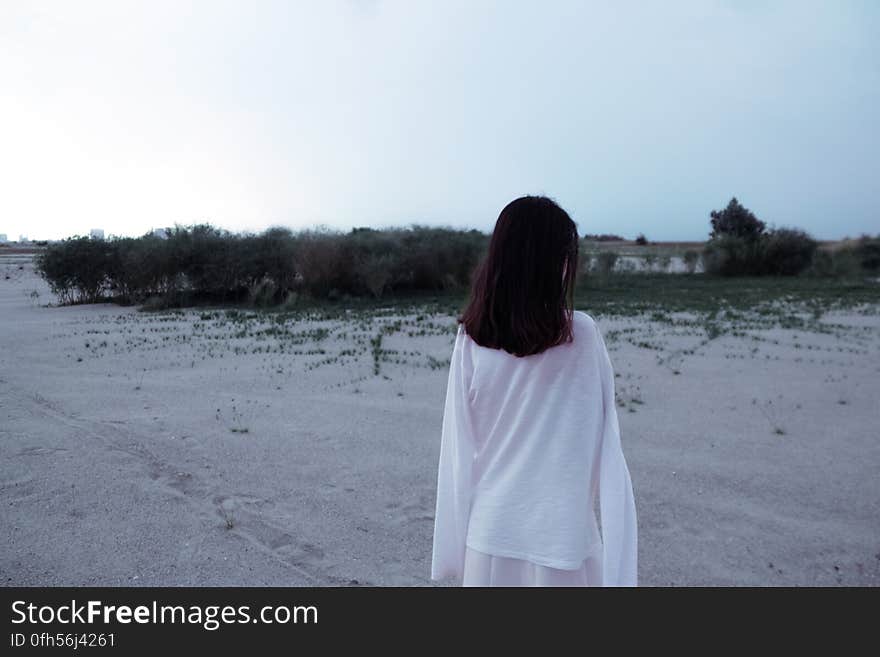 Rear View of Woman Standing on Beach