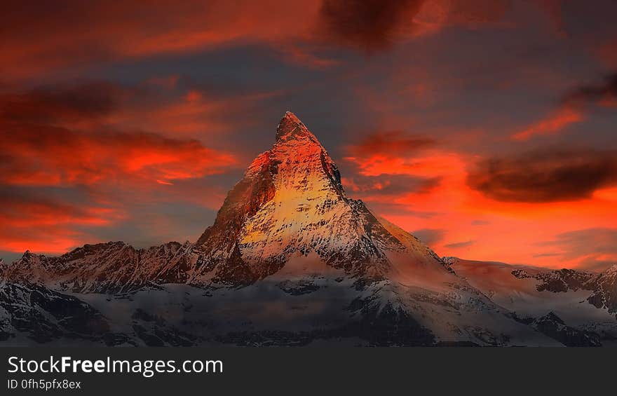 Brown and Gray White Mountain Under Cloudy Blue Sky