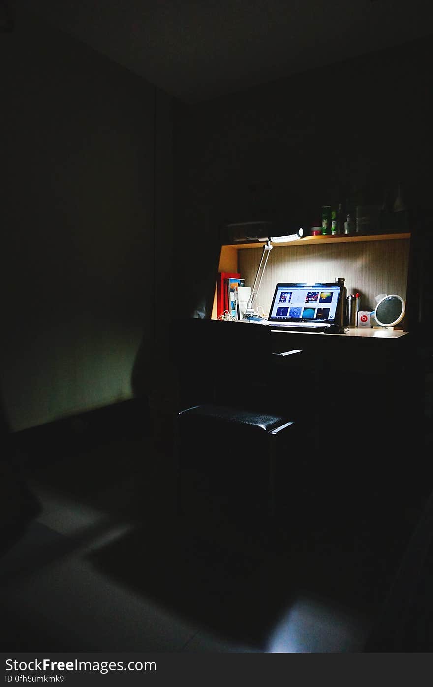 Black Laptop in Study Table Near Lamp