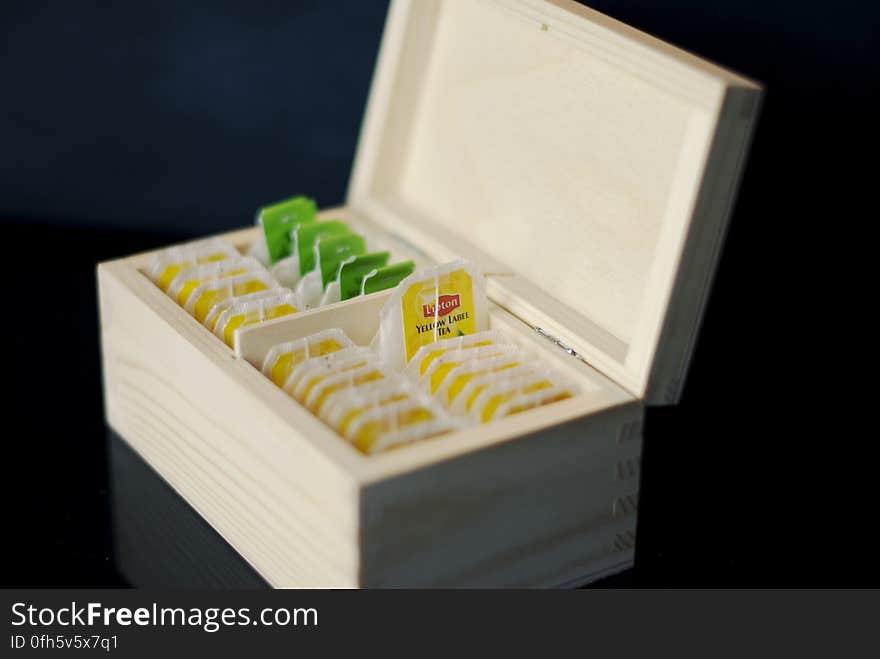 A wooden box with tea bags. A wooden box with tea bags.