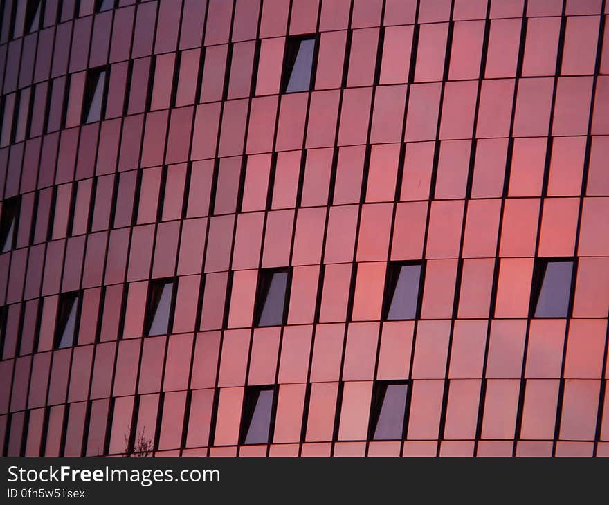 Black Mirror Mounted on Red Wall Building