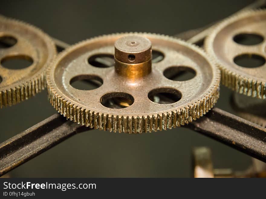 These gears pass some the energy provided by the operator turning a crank to the rear section of Tide Predicting Machine No. 2, a special purpose mechanical analog computer for predicting the height and time of high and low tides. The U.S. government used Tide Predicting Machine No. 2 from 1910 to 1965 to predict tides for ports around the world. The machine, also known as “Old Brass Brains,” uses an intricate arrangement of gears, pulleys, chains, slides, and other mechanical components to perform the computations. A person using the machine would require 2-3 days to compute a year’s tides at one location. A person performing the same calculations by hand would require hundreds of days to perform the work. The machine is 10.8 feet &#x28;3.3 m&#x29; long, 6.2 feet &#x28;1.9 m&#x29; high, and 2.0 feet &#x28;0.61 m&#x29; wide and weighs approximately 2,500 pounds &#x28;1134 kg&#x29;. The operator powers the machine with a hand crank. These gears pass some the energy provided by the operator turning a crank to the rear section of Tide Predicting Machine No. 2, a special purpose mechanical analog computer for predicting the height and time of high and low tides. The U.S. government used Tide Predicting Machine No. 2 from 1910 to 1965 to predict tides for ports around the world. The machine, also known as “Old Brass Brains,” uses an intricate arrangement of gears, pulleys, chains, slides, and other mechanical components to perform the computations. A person using the machine would require 2-3 days to compute a year’s tides at one location. A person performing the same calculations by hand would require hundreds of days to perform the work. The machine is 10.8 feet &#x28;3.3 m&#x29; long, 6.2 feet &#x28;1.9 m&#x29; high, and 2.0 feet &#x28;0.61 m&#x29; wide and weighs approximately 2,500 pounds &#x28;1134 kg&#x29;. The operator powers the machine with a hand crank.