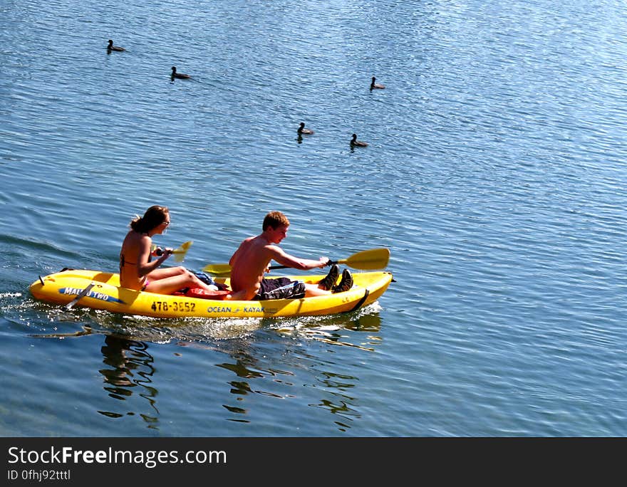 A couple departing on the kayak into Lady Bird Lake from Zilker. A couple departing on the kayak into Lady Bird Lake from Zilker.