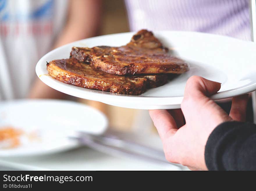 Close-up of Man Preparing Food in Plate