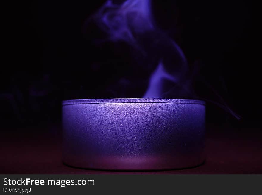 Close-up of Blue Candle Against Black Background