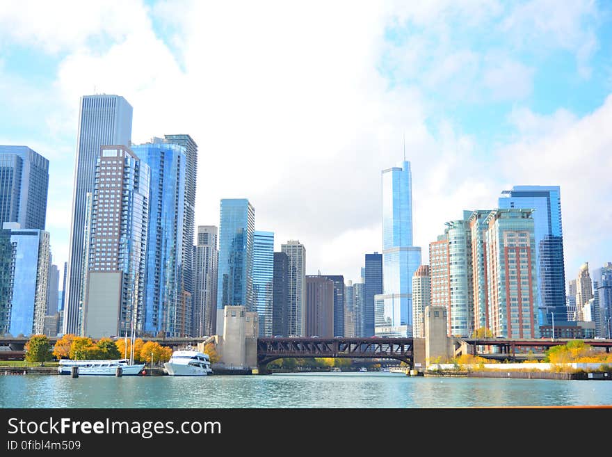 City at Waterfront Against Cloudy Sky