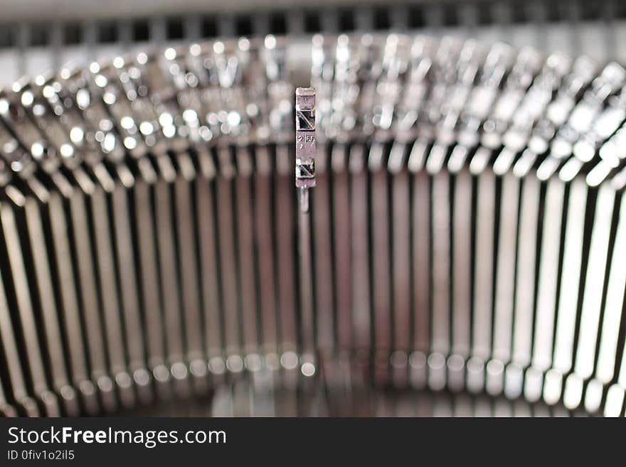 A close up of the typebars of an old mechanical typewriter. A close up of the typebars of an old mechanical typewriter.