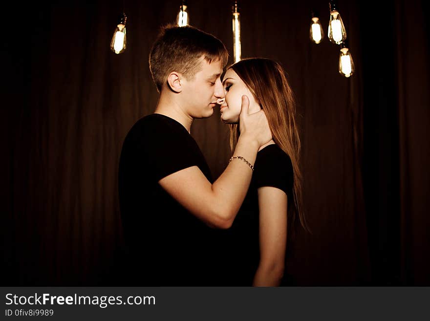 Young Couple Kissing at Night