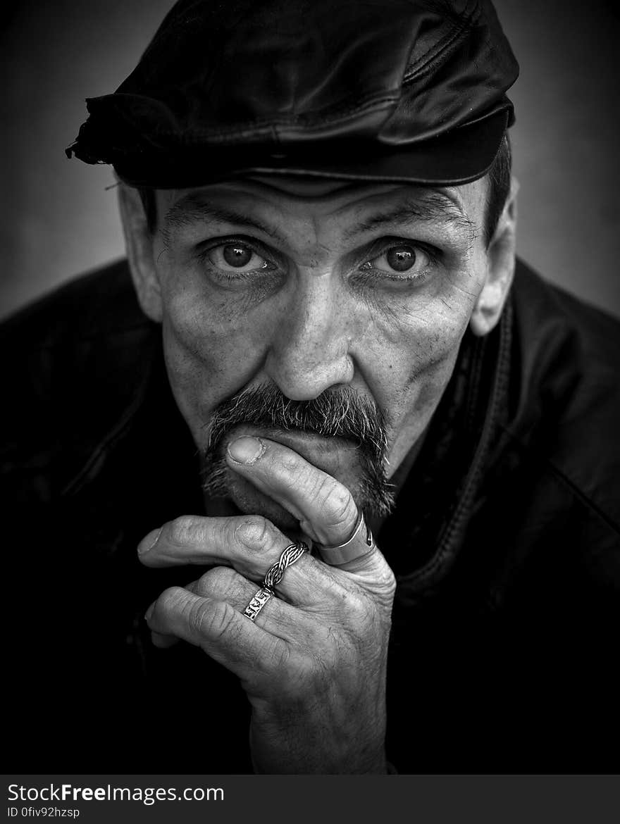 Grayscale of Photo of Men&#x27;s Wearing Black Leather Hat