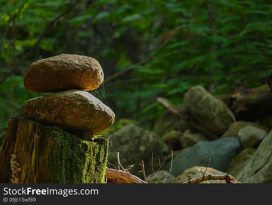 Stacked stones, lonely lighting.