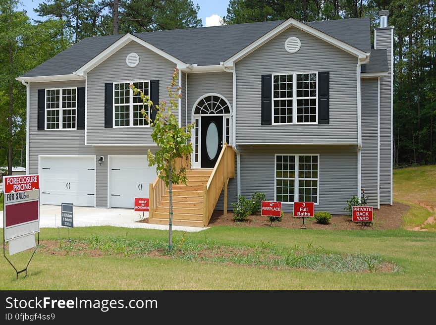 Exterior of foreclosed home offered for sale. Exterior of foreclosed home offered for sale.