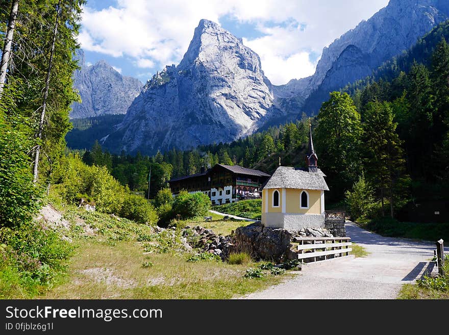 View of Village With Mountain Range in Background