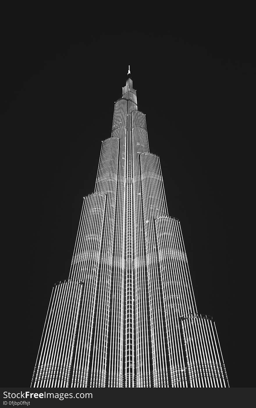 Low Angle View of Skyscraper Against Sky at Night