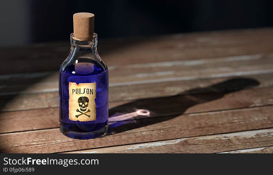 Purple Liquid Poison on Brown Wooden Surface