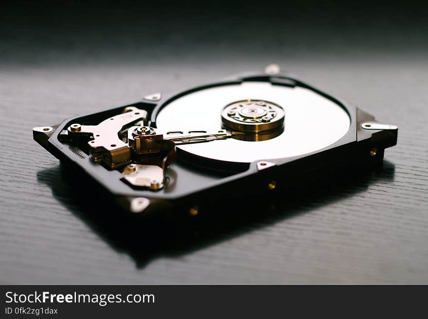 A hard disk drive opened up.