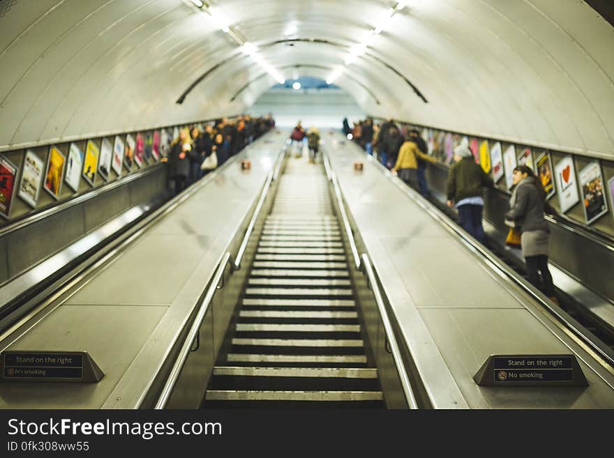 Stairs and escalators leading to a subway station. Stairs and escalators leading to a subway station.