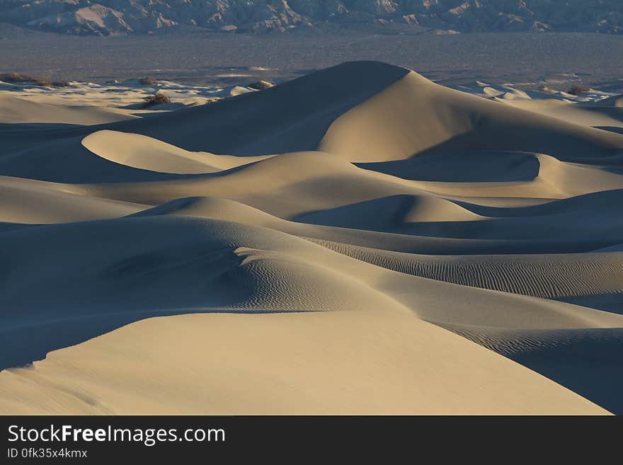 A desert landscape with sand dunes.