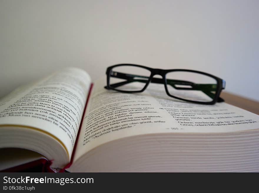 Close-up of Eyeglasses on Book