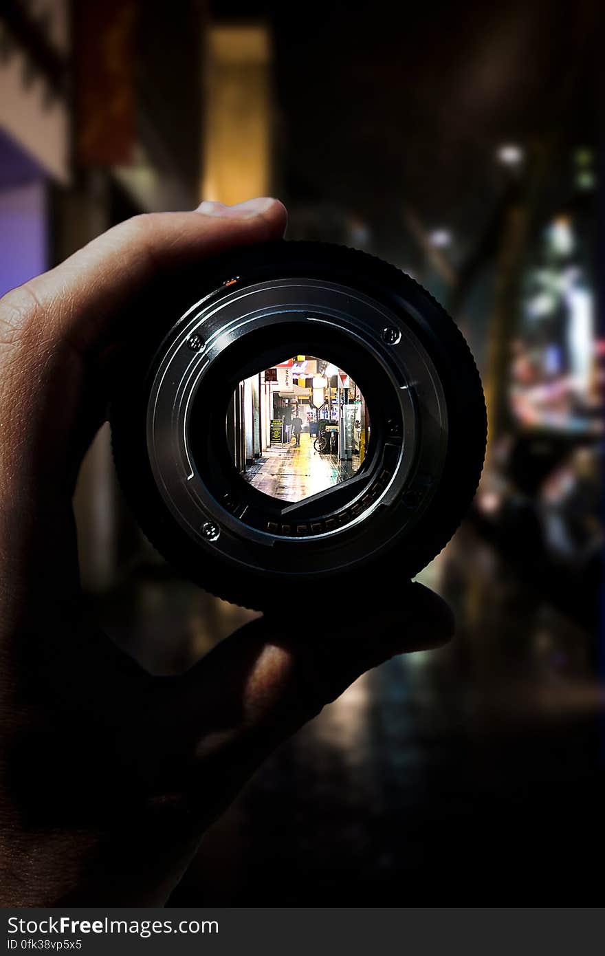 View of night scene in city through camera lens. View of night scene in city through camera lens.