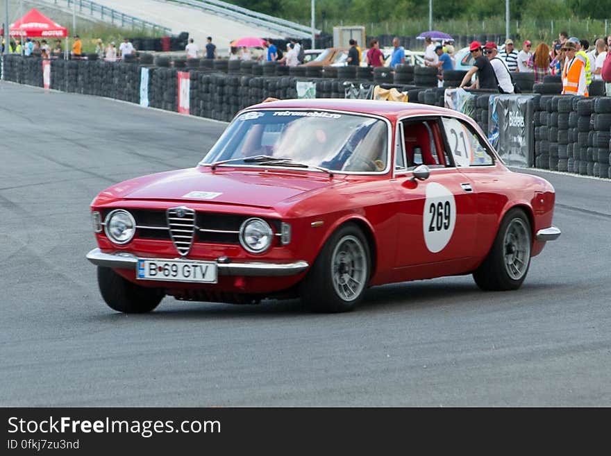 Alfa Romeo 1966 classic car competing in a retro automobile popular race.