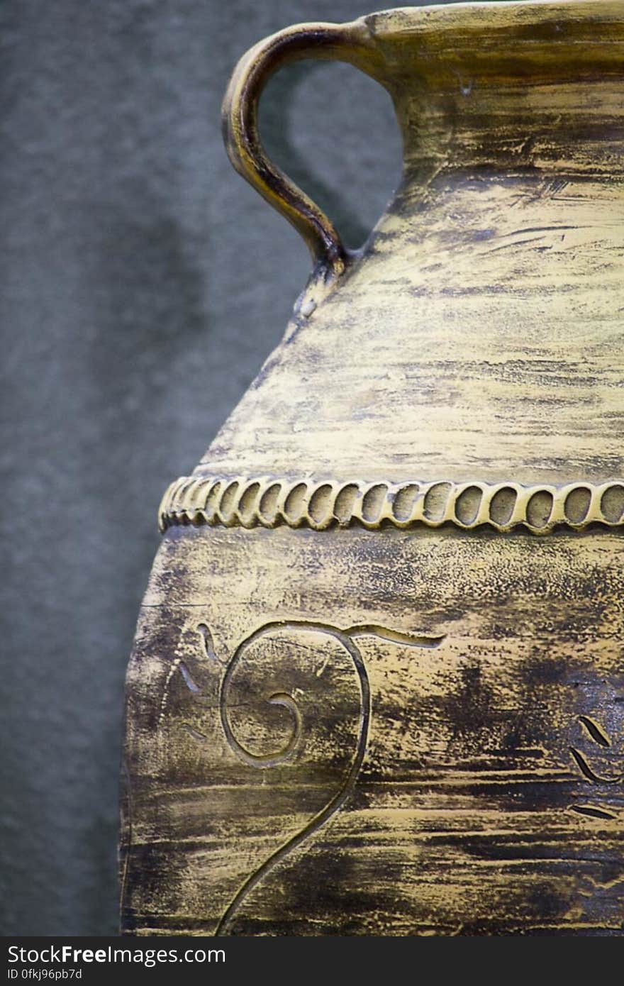 Ornamental ceramic amphora in a public garden.