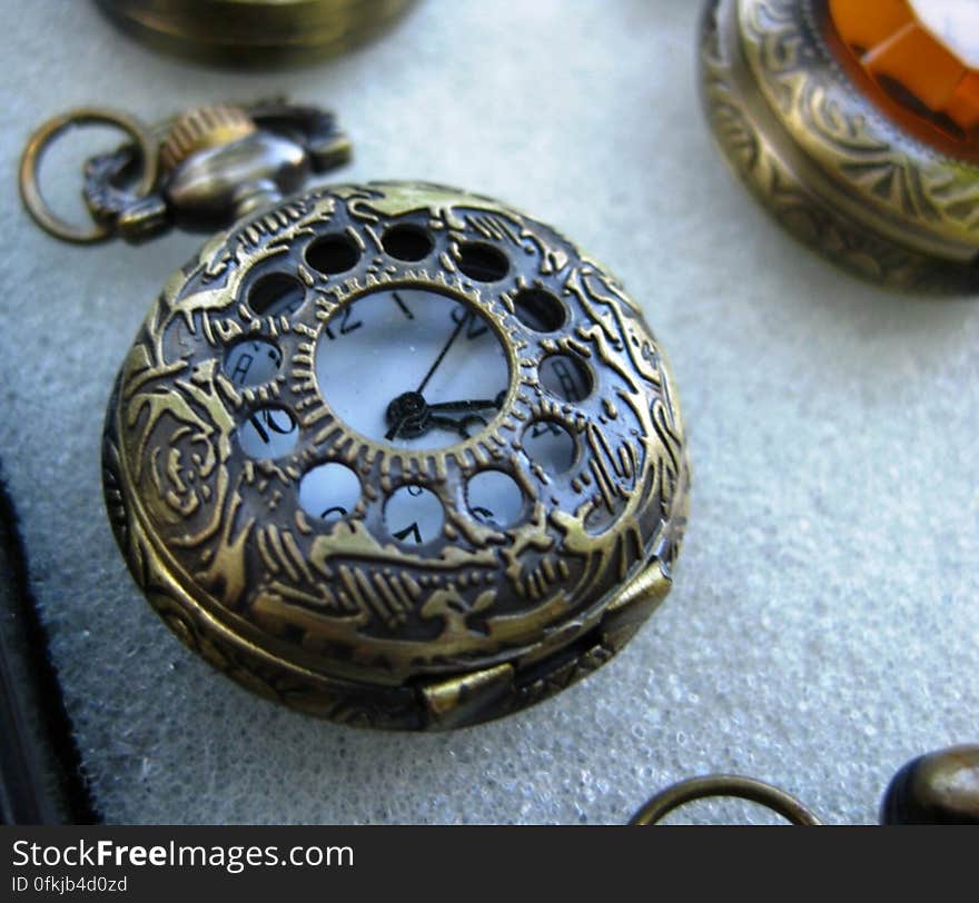 antique-pocket-watch-with-ornamented-bronze-casing