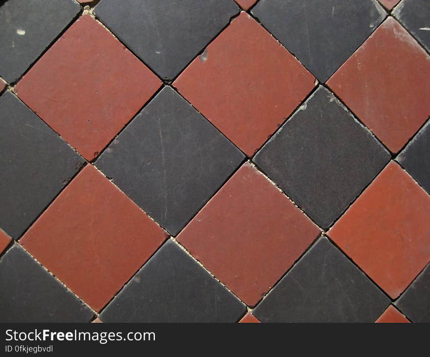 black-and-burgundy-diamond-pattern-tiles