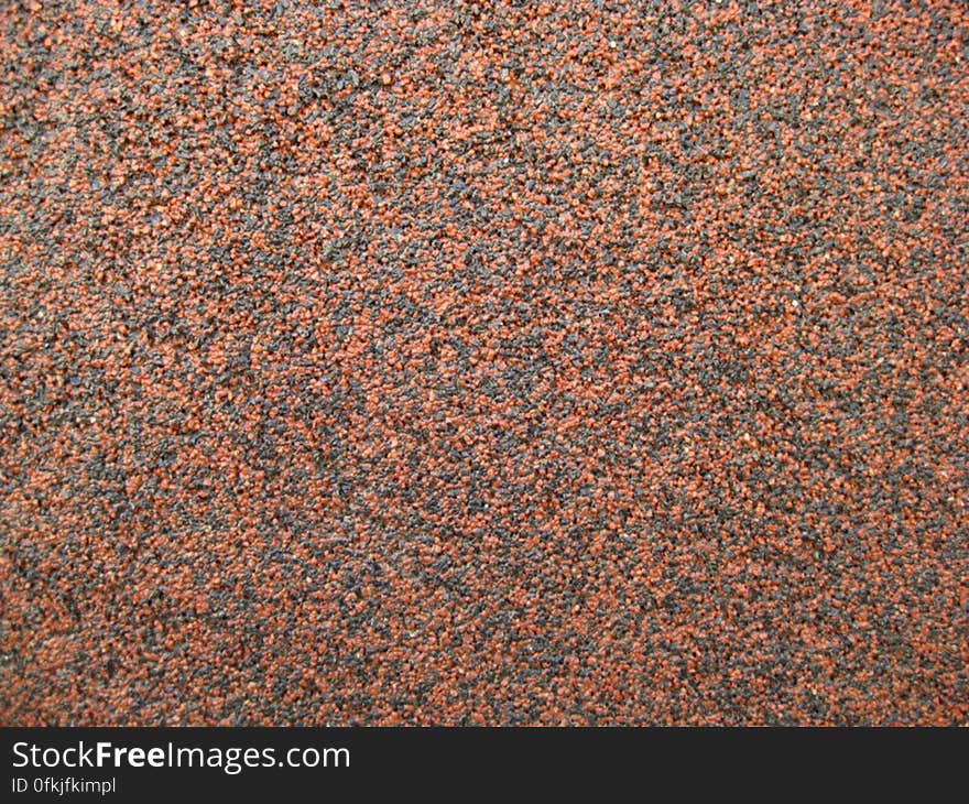 black-and-orange-mineral-sand-texture