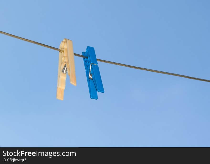 blue-and-yellow-pegs-on-clothes-line