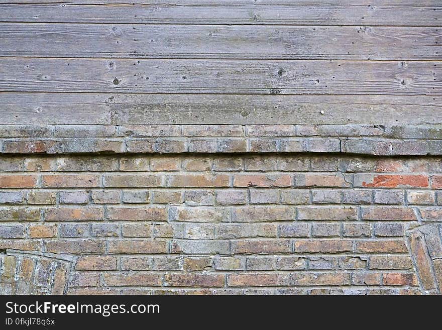 Building with a combined exterior wall. Ground level was built using layered bricks, while first level wall is wooden. Building with a combined exterior wall. Ground level was built using layered bricks, while first level wall is wooden.