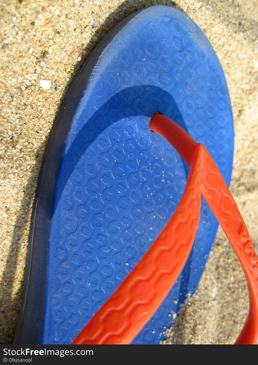 colorful-flip-flop-on-sand