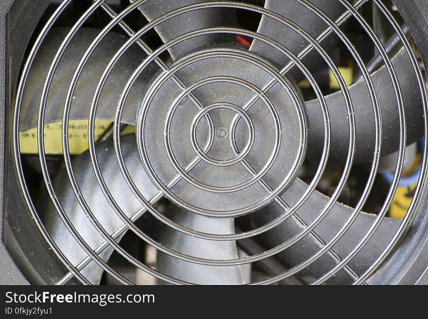 Photo of a power supply fan, one of the most important cooling sources for the PC. The fan is located at the rear of the power supply.