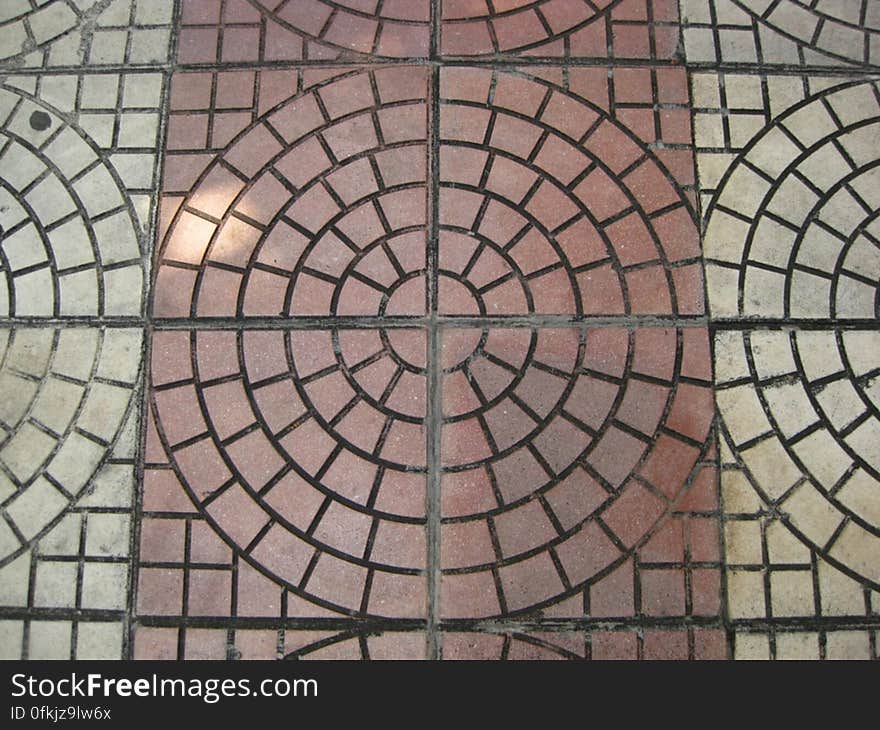 concentric-reddish-and-grey-pavement