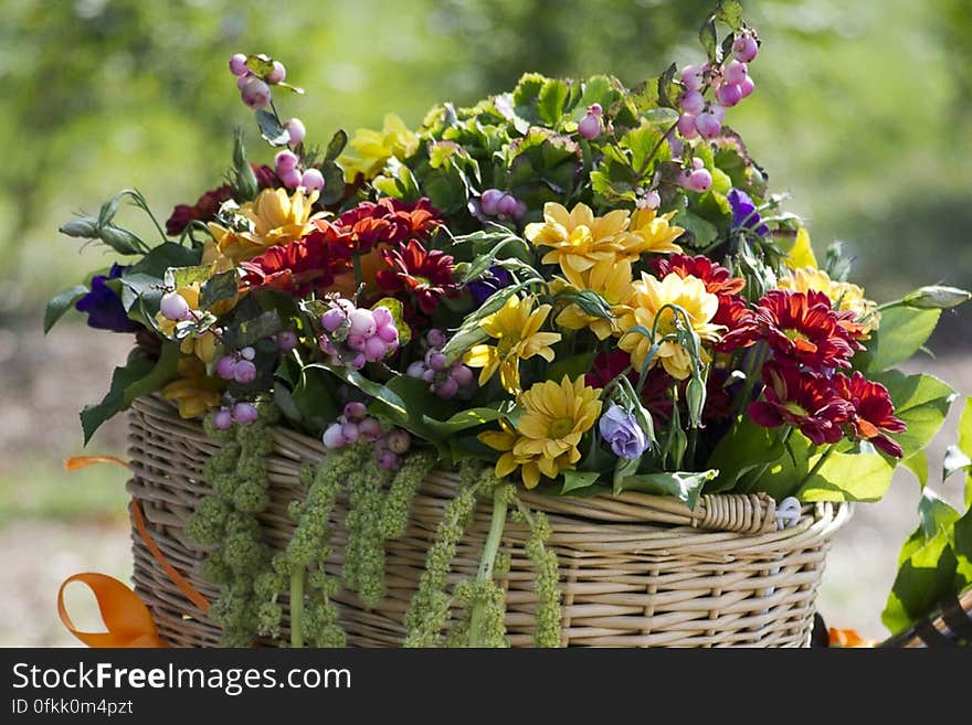 Beautiful summer floral arrangement in a wicker basket.