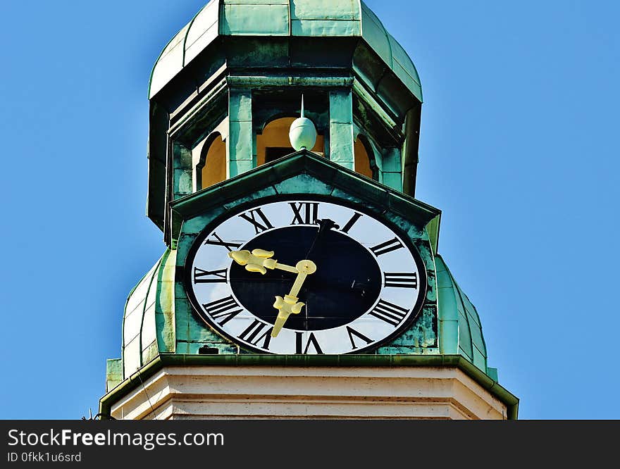 Tower Clock Under Blue Sky during Daytime