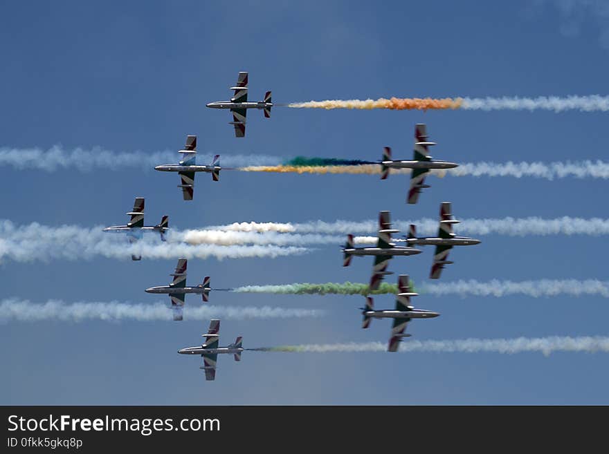 Italian Frecce Tricolori air acrobatics planes engaged in a head-on pass.