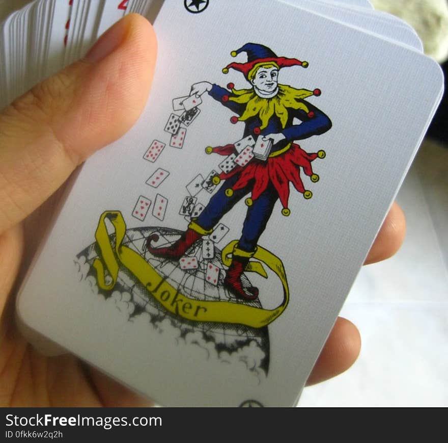 hand-holding-pack-of-cards